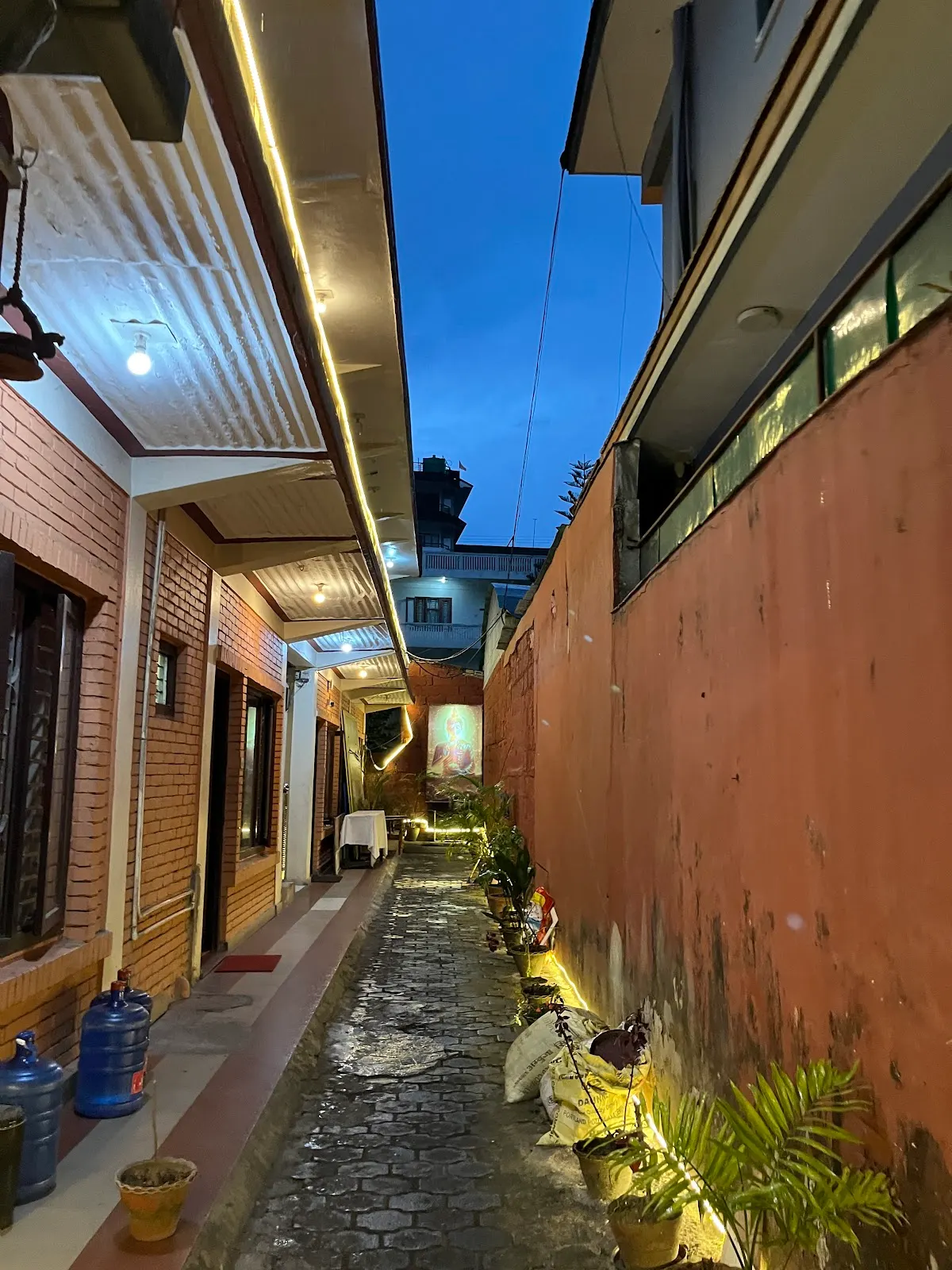 Serenity Spa entrance lit at dusk on Lakeside Road, Pokhara.